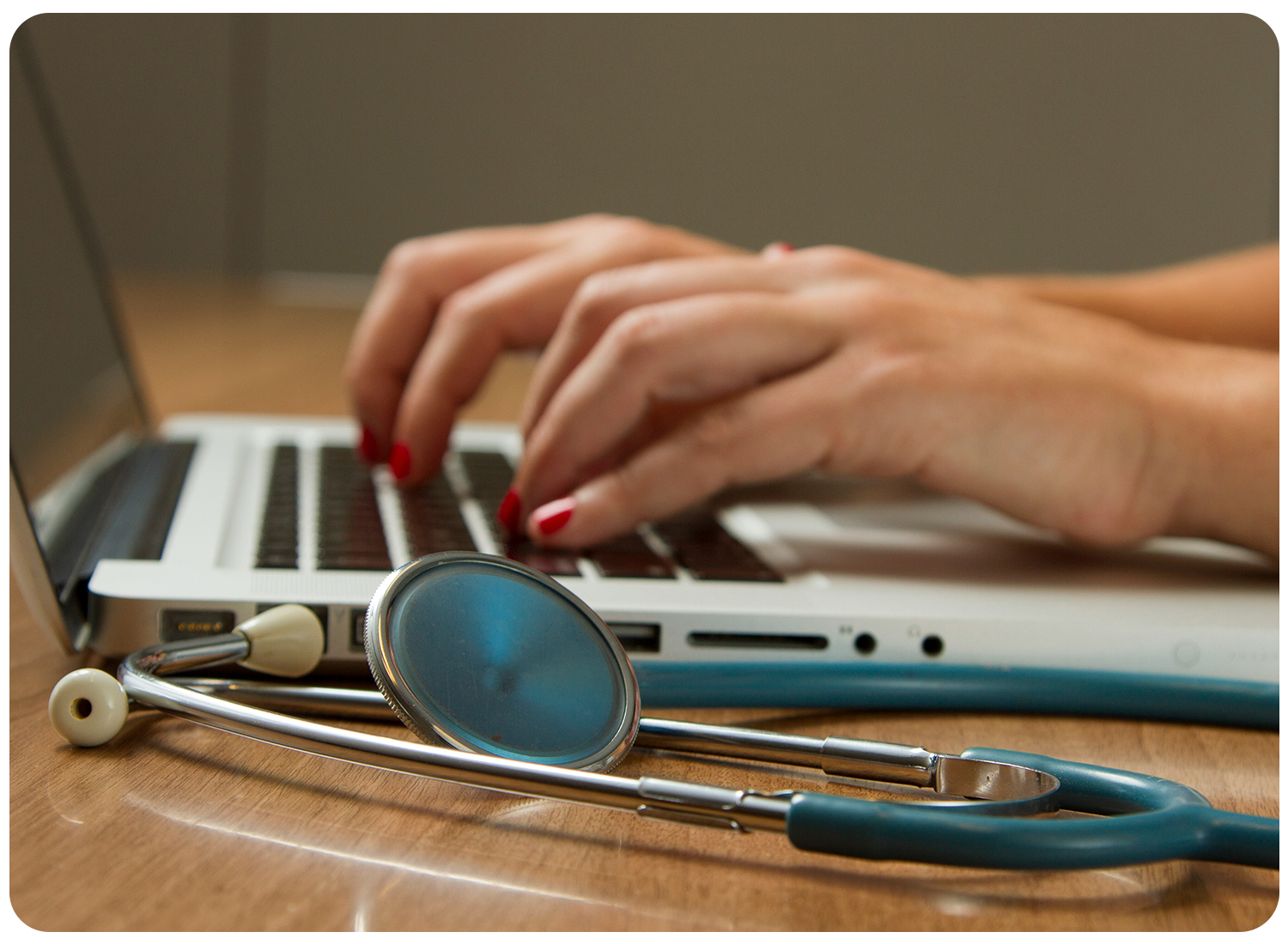 Person typing on keyboard